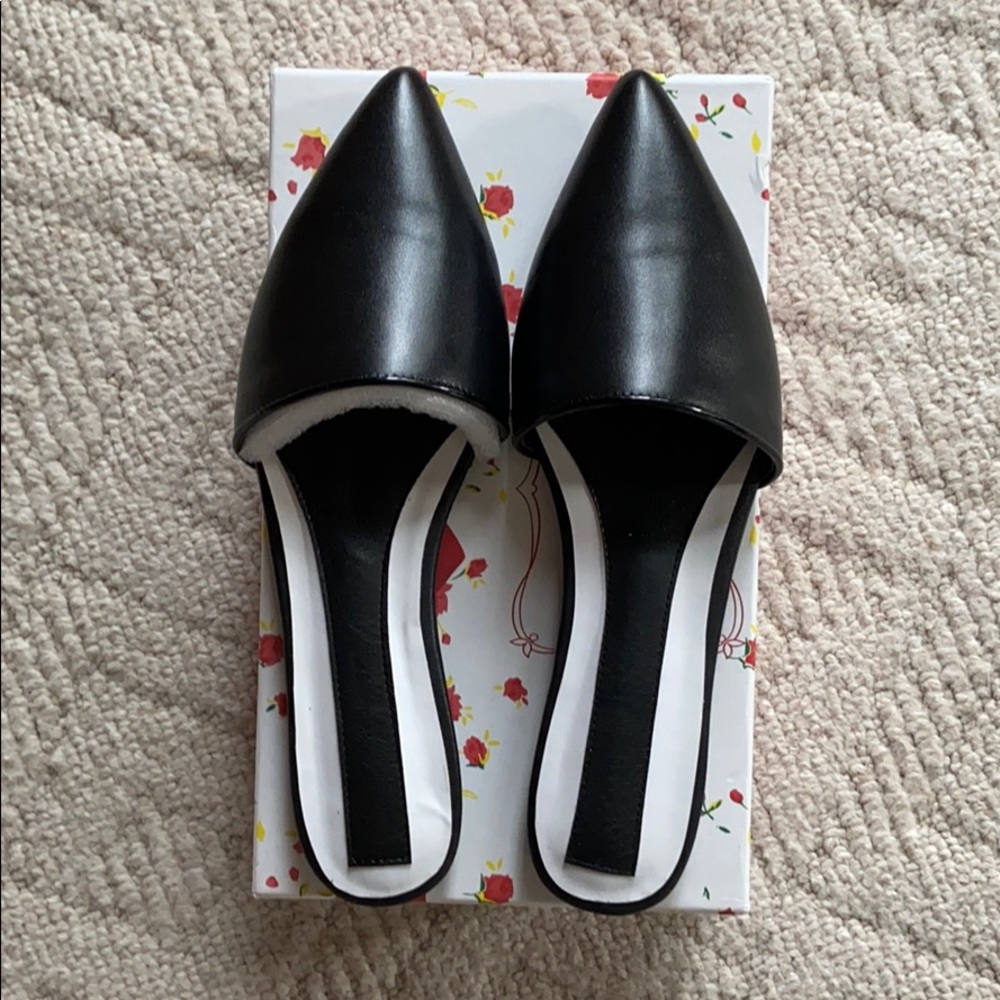 New/never worn in the box black leather mules